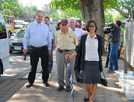 Members arrive at the ceremony.