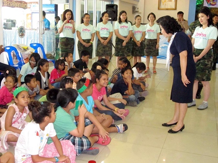 The Navy Wives Association helps teach youngsters to speak English.