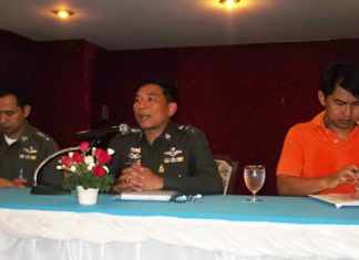 Col. Chatchawan Pisuthwong (center) lays out policies on morality and service for his officers.