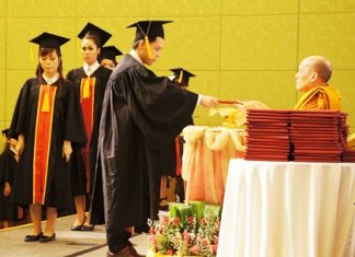 Students receive their certificates from Dr. Phraratsithamunee, assistant to the abbot of Wat Mahathatyuwarat Rangsaritatchawarom Mahaviharn, MD of the International Vipassana Thura (the burden of contemplation) project.