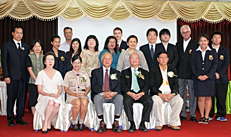 University president Dr. Viphandh Roengpithya (center) sits for a commemorative photo with students, teachers and local officials during the opening ceremony.