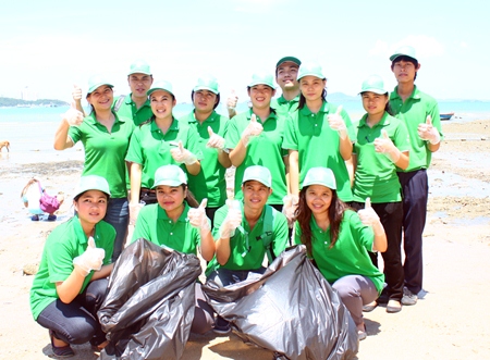 Holiday Inn Hotel employees join the fun in cleaning up the beach during the Love the Sea, Save the Beach event.