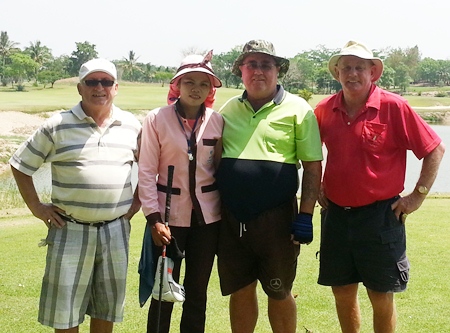 Jimmy O’Neill, Owen Walkley and Bob Philp pose with a caddy at Blue Sapphire.