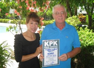 Jim Neilson and his lovely wife hold up the 1st prize KPK Foods voucher.