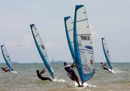 Sailors compete at the 2013 Thailand Windsurfing Championships held at Jomtien Beach, Pattaya.