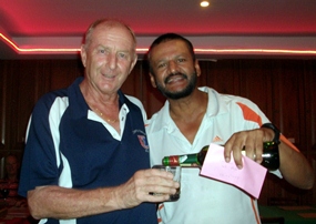Monthly medal winner Chaten Patel (right) shares a drop of the good stuff with Colin Davis.
