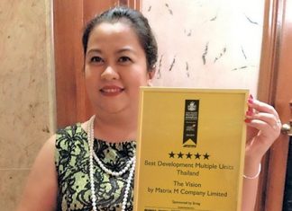 May Watson proudly holds up the Asia Pacific Property Award presented to Matrix Developments for its Vision condominium project.