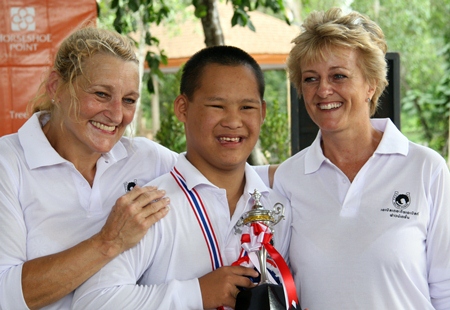 The overall winner, Tom, is congratulated by Sandra Cooper, right, and volunteer trainer, Diane.