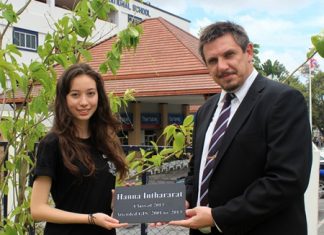GIS Principal Dr Stuart Tasker presents Hannah with a special plaque.