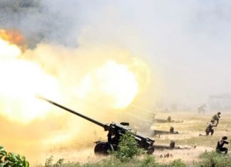 Soldiers practice firing their big guns during the annual Air and Coastal Defense Command exercise in Sattahip.