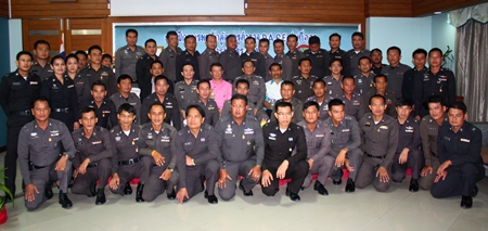 All 40 policemen taking part this semester pose for a class photo with officials and instructors after the opening ceremony.