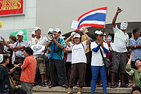 About 200 anti-government protesters - many wearing white masks - converge on the Tesco-Lotus North Pattaya branch.  The group’s Facebook page says it represents “people power” urging peaceful opposition to “parliamentary monopoly and corruption.”  