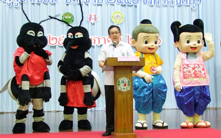 Dr. Pornthep Siriwanarangsun, with help from a quartet of mascots, teaches students at Assumption School how to avoid getting dengue fever and how to get rid of mosquitoes.