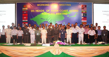 Delegates pose for a group photo during this summit of Coast Guard agencies from 19 countries.