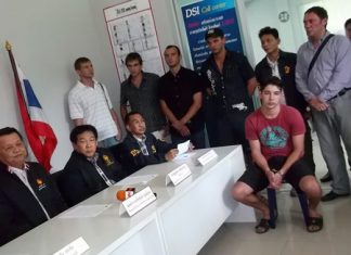 Ayrat Kabiryanof (seated, front right wearing handcuffs) has been arrested for loan sharking and human trafficking.