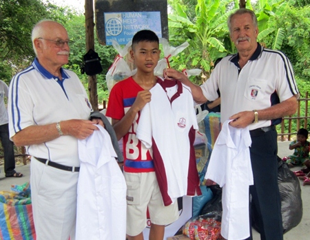 The older children receive their uniforms.