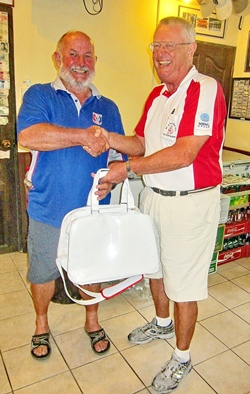 Dick Warberg (right) presents the MBMG Group Golfer Of The Month award to Max Bracegirdle.