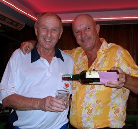 Colin Davis (left) accepts a drop of the ‘good stuff from Monthly Medal winner Nick Shaw.