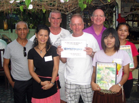 Tuesday’s winners pose with the staff at The Relax Bar.