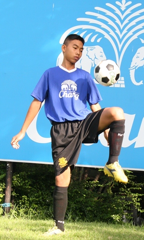 Showing off his soccer skills.