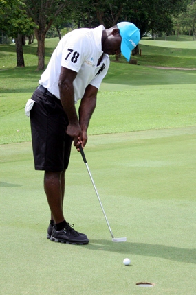 Andy Cole scores on the green.