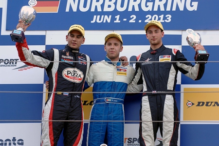 Sandy Stuvik (left) stands on the podium with Ed Jones (center) and Hector Hurst (right) after Race 1 at the Nürburgring in Germany, Saturday, June 1.