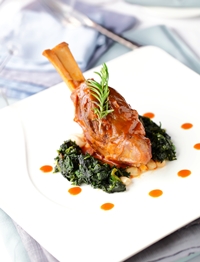 Braised lamb shank on cannellini beans available at Acqua.