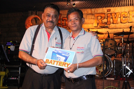Peter Malhotra presents a ‘much needed’ battery to Boonlua Chatree, the longest tenured reporter at Pattaya Mail.