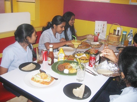 Tucking in to tacos - GIS students enjoyed their Spanish lunch.