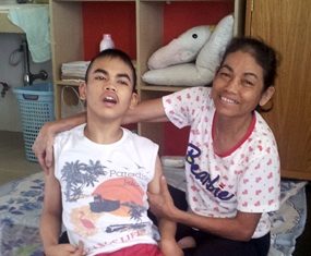 Tewid and his mother at the Camillian Home in Lat Krabang.
