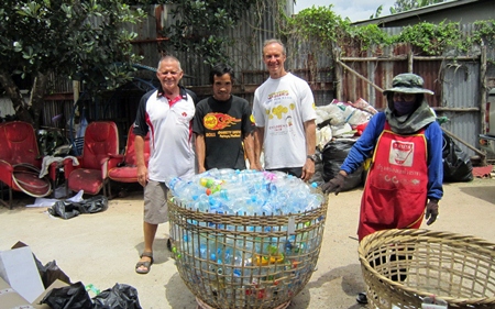 Bill, Mr. Rung and Woody at the recyclable center with a basket of plastic bottles the students gathered over the last term.