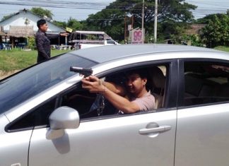 Niran Limchoey shows police how he allegedly shot and killed one of his rivals.