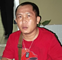 Police didn’t have to go far to find Kittikorn Hinkong, as he at outside the shop drinking the whiskey while staring at the girl.