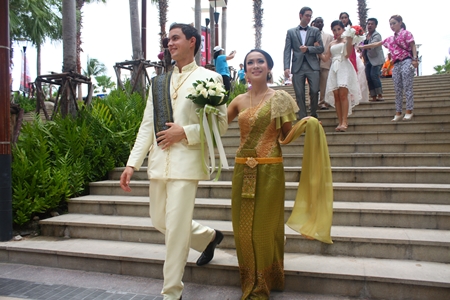 The wedding entourage makes its way from Beach Road into Central Festival Pattaya Beach.