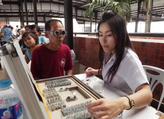 Pattaya citizens trying on glasses to find the one that suits their personality best.