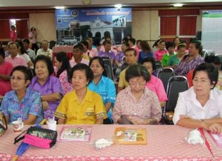 Chonburi residents listen in to a lecture about how they should keep their properties clean and tidy.