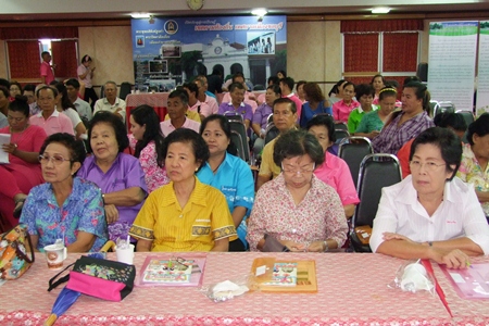 Chonburi residents listen in to a lecture about how they should keep their properties clean and tidy.