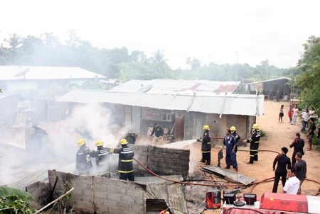 It took firefighters about 30 minutes to extinguish the fire that swept through two houses at a Sattahip construction camp.