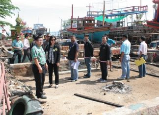 Deputy Mayor Verawat Khakhay (front left) leads city officials to inspect Naklua’s Soi Kanrua boatyard district with the intent of stopping flooding there.