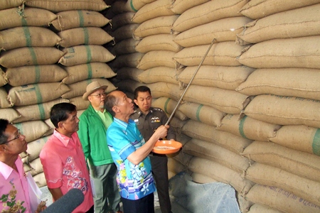 Gov. Khomsan Ekachai led police and government officials in checks of five rice warehouses in Chonburi City and two in Phanat Nikhom.