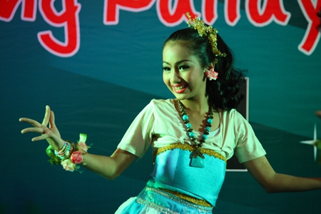 A young student from Pattaya School No. 8 beams a beautiful smile during her team’s performance.