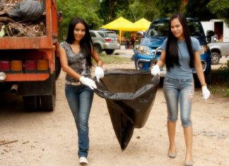 Local lassies help clean up Buddha Hill. (Photo by Aliona Mikhaylova)