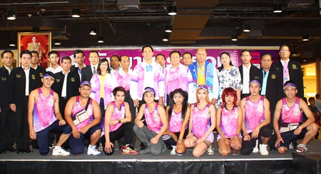 Race organizers, city officials and sponsors pose with runners following the July 12 press conference to announce details of this weekend’s King’s Cup Pattaya Marathon.