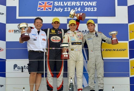 Runner-up Sandy Stuvik (2nd left) of Thailand poses on the podium with winner Santiago Urrutia (2nd right) and third placed Ed Jones (right) at the Silverstone racetrack in England, Sunday, July 14.
