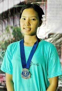 Lalita Phetphuang proudly wears her presidential seal from the Banglamung School Interact Club.