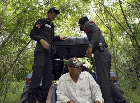 Officials search the surrounding areas that might be hiding 11 of 17 Rohingya migrants that escaped immigration custody in Rayong.