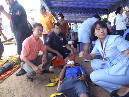Residents and rescue workers practice emergency drills in Song Pheenong, Rayong.