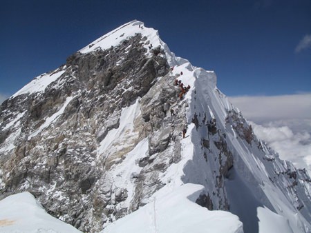 The peak of Everest, including the traffic jam on the infamous ‘Hilary Step’, as seen from the South Peak.