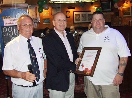 Chairman Derek Brook and President Graham MacDonald present a certificate of appreciation to Mick Newblatt from the British Embassy’s Foreign and Commonwealth Office.