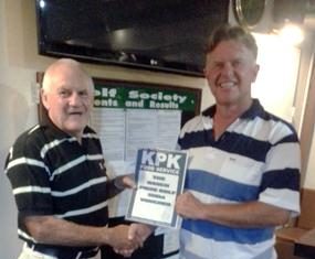 Tony presents the KPK voucher to Colin Greig.